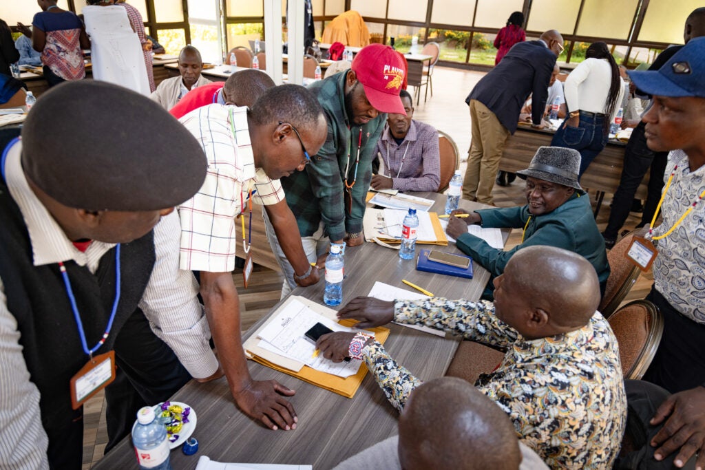 A moment of exchange between government officials and Indigenous Peole and local community representatives during a workshop focused on equitable carbon finance in Nairobi, Kenya on April 11, 2025. Photo by Diego Acosta-López/EDF.